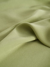 The green cloth is made of lyocell fabric.
